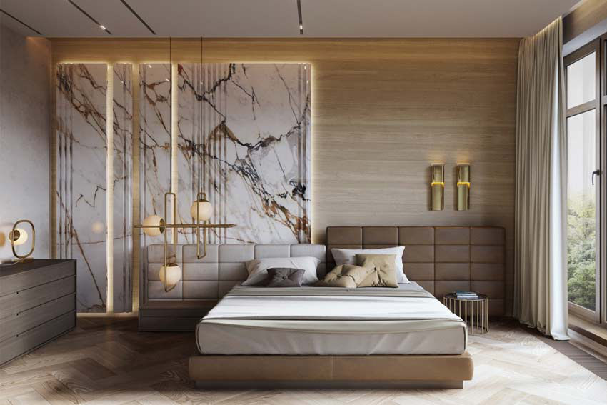 Bedroom with a marble feature wall, upholstered bed and warm wall lights